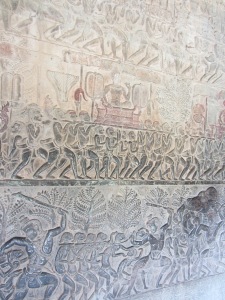These are some of the amazing and intricate carvings that covered miles of walls throughout Angkor Wat.  Just many small men right?  Actually, you're looking at a depiction of heaven, hell, and the 'middle world.'